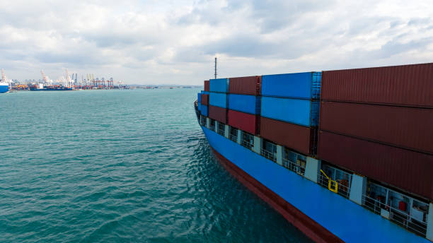 istock logistic cargo container ship sailing in sea to import export goods and distributing products to dealer and consumers across worldwide, aerial side view 1919217194