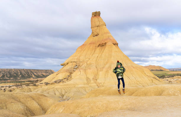 istock Boy jumping in a desert landscape 1919221448
