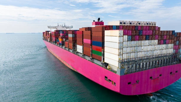 istock global business cargo logistic  container ship sailing in sea  import export goods and distributing products to dealer and consumers worldwide, back view from drone, 1919223593