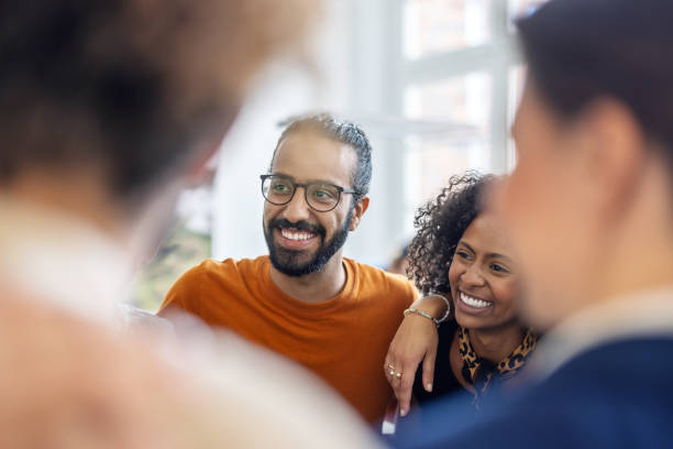 istock Business team standing together with their arm around in office 1919230376