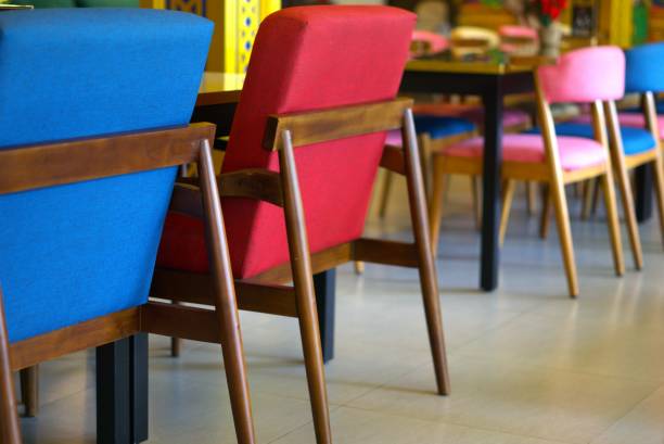 Colorful chair and table in restaurant, modern and comfortable furniture, concept of interior design
