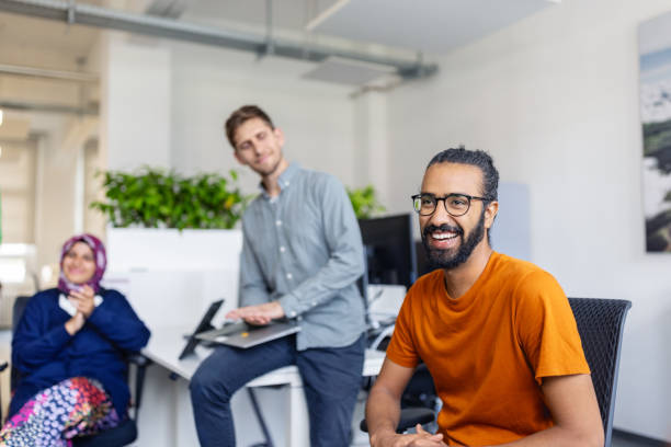 istock Group of people smiling during meeting in office 1919246477