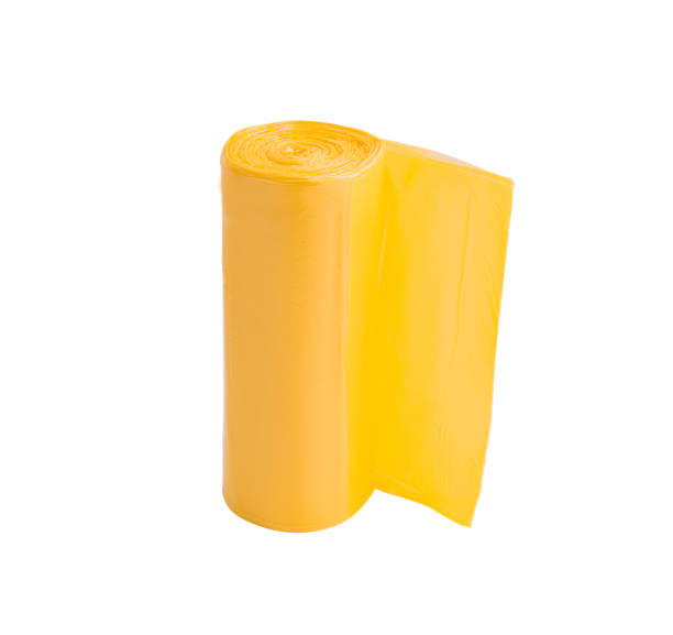 istock Yellow roll of garbage bags isolated on white 1919247000