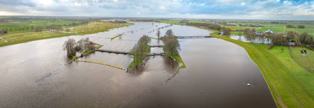 istock Vecht river high water level flooding at the Vechterweerd weir drone view 1919250231