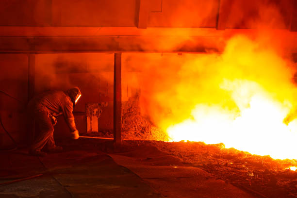 istock iron works blast furnace taphole spewing molten iron 1919251150