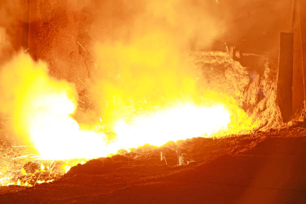 istock hot molten iron flowing from blast furnace 1919252954