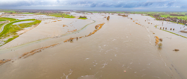 IJssel river with high water level on the floodplains of the river IJssel at the Reevediep bypass after a long period of heavy rain upstream in December 2023. For the first time the river IJssel flows directly in the new anabranch Reevediep near Kampen.