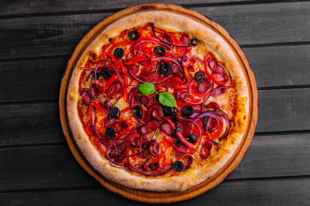 istock Pizza with Bavarian sausages with bell pepper and red onion 1919257788