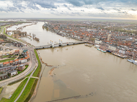 IJssel river with high water level on the floodplains of the river IJssel at the city of Kampen on the riverbanks of the river after a long period of heavy rain upstream in December 2023.