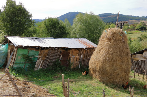 a haystack in the farmyard at an village in albania