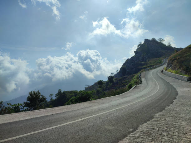 istock uphill highway with blue sky in the background 1919292098
