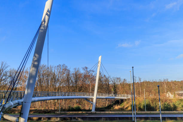 istock Cable-stayed bridge for bicycles and pedestrians over highway 1919294917