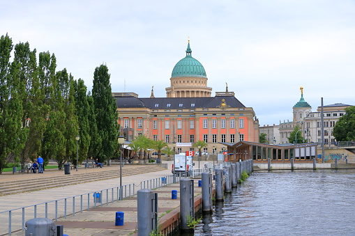 July 31 2023 - Potsdam, Brandenburg in Germany: Nicholas Church (Nikolaikirche) near the harbor on a cloudy day