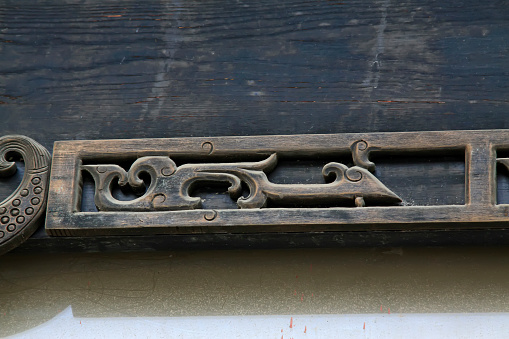 Carved wooden frame decoration, closeup of photo