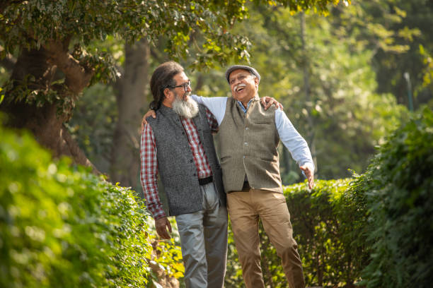 istock Senior friends talking and laughing in garden 1919364412