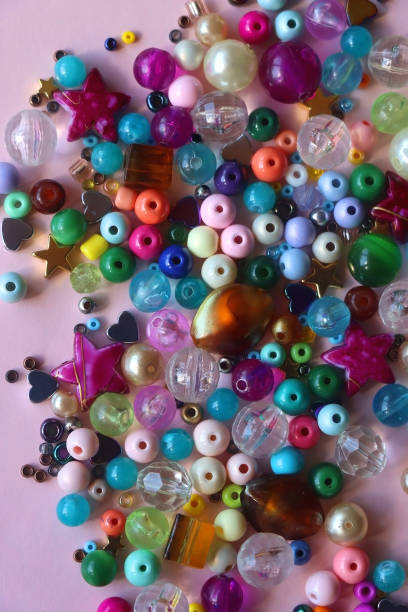 istock Colorful Beads on Pink Background 1919368080