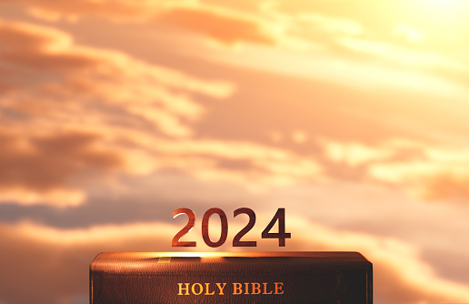 New year 2024, rising sun, sunrise and sunset background, cross of Jesus Christ, holy Bible, faith in god, conviction, mercy, peace and church calendar concept