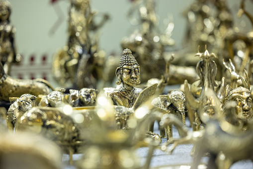 Brass metal art, Handmade lion sculpture souvenir made with brass with blur background. Selective focus.