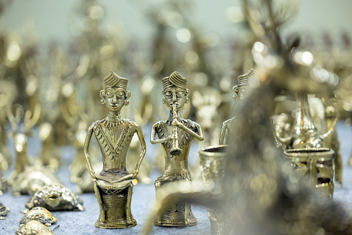 Brass metal art, Handmade lion sculpture souvenir made with brass with blur background. Selective focus.