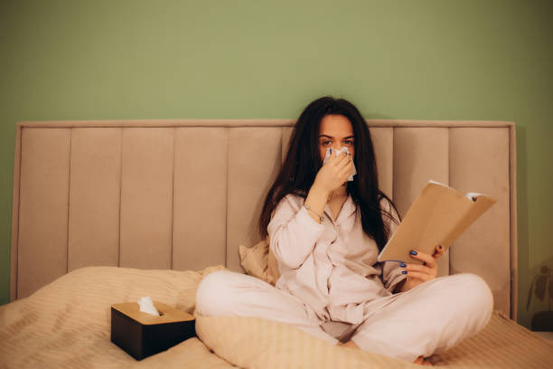 istock A woman crying on a book under stress. 1919406673