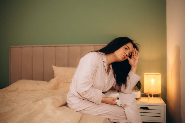 istock Image of sick woman lying in bed 1919406681
