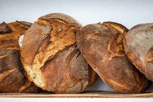 Bread for sale in a basket or shelves in a bakery in Altamura, Bari, Puglia, Italy