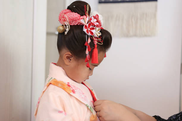Nihongami.Shichigosan which is A 3-year-old Japanese girl has life events to pray for her health wearing a kimono.
