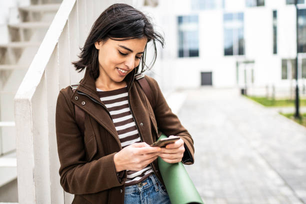 istock Young happiness woman using smart phone 1919504698