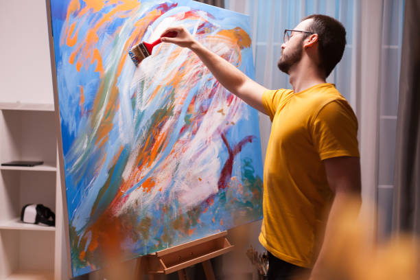 istock Man painting a masterpiece 1919517079