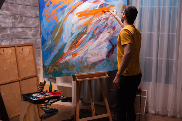 istock Young man with painting skill 1919540014