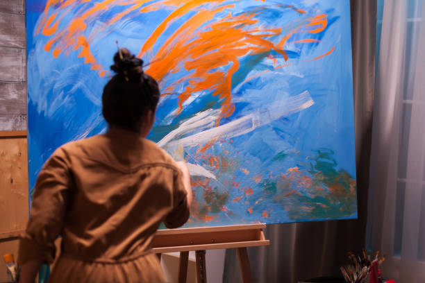 istock Young person painting 1919540024