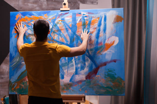 istock Artist painting with fingertips 1919548006