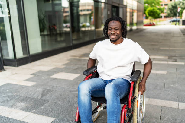 istock Happy young black man in wheelchair 1919552245