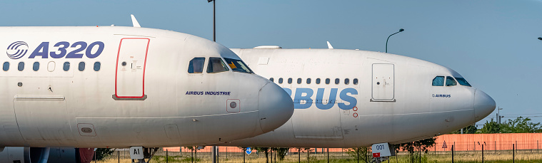 Toulouse, France -  July 21, 2021 : View of a AIRBUS A320 and A340.