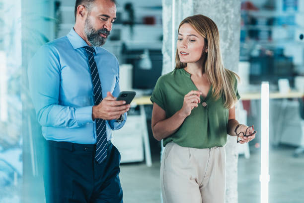 istock Business colleagues talking in the office 1919568635