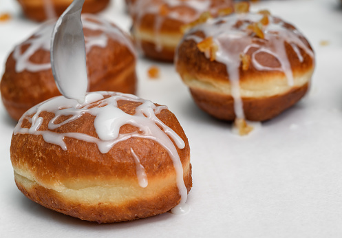 Close-up of glazed donuts, production for Fat Thursday closeup