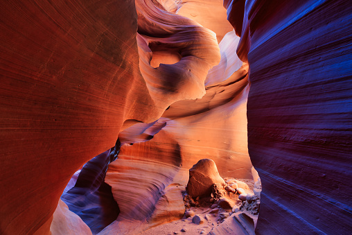 Page Arizona United States - April 7th, 2014 : A female tourist hiking and looking over the cracks at the Lower Antelope Slot Canyon, Page Arizona.