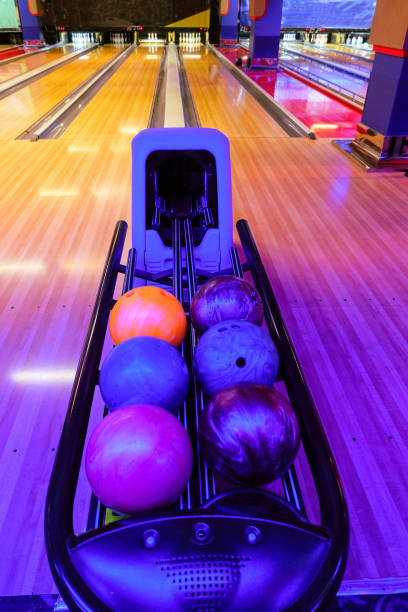 istock Racks with bowling balls. Bowling ball return system in bowling hall. 1919641312
