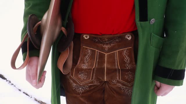The lower part of the men's national costume, brown leather trousers with embroidery in the national style