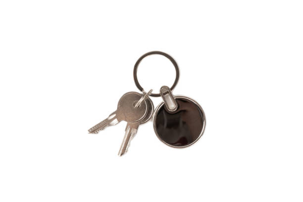 istock Keychain with key ring isolated on white background. Concepts for real estate and moving home or renting property. Buying a property. Mock-up keychain.Copy space. 1919661789