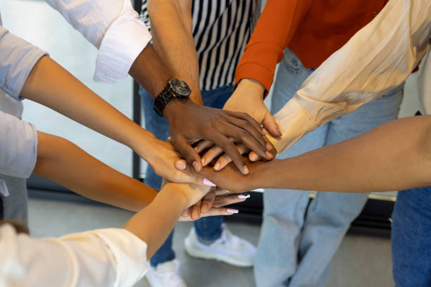 istock Unrecognizable business team holding their hands together 1919663390