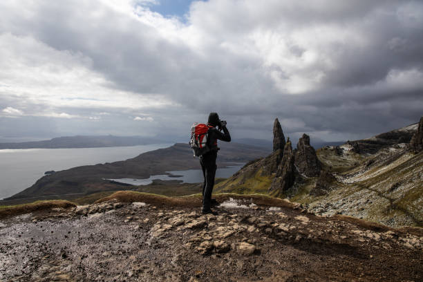 Silhouette of a man hiking in Scotland.