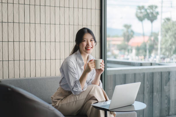 istock Female Business Professionals Working on Laptops and Enjoying Coffee at Cafes. Remote work concept 1919717117