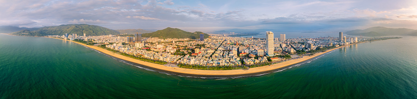 Drone panorama view of Quy Nhon city from the sea in golden hour- Quy Nhon city, Binh Dinh province, central Vietnam
