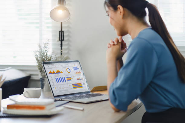 istock Analyst woman working with information database to analyze marketing and sales data. Business analytics dashboard with charts, metrics, and KPIs concept. 1919725233