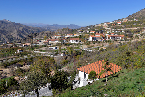 Lachin, Azerbaijan: the town and the road leading to the Armenian border (know in Armenian as Berdzor) - The city is located on the hillside on the left bank of the Hakari River. The name Laçın means “falcon”. From 1992 to 2020 it was occupied by the internationally unrecognized Republic of Artsakh and from the 2020 to 2022 it was administered under Russian protection as part of the Lachin Corridor. Azerbaijan took control on August 26th, 2022.