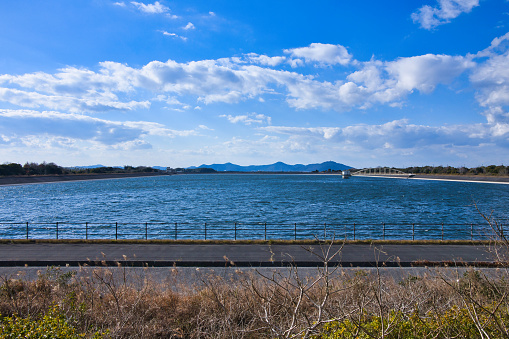Manba Regulating Pond with white waves from Toyokawa Irrigation Water in Toyohashi City, Aichi Prefecture
