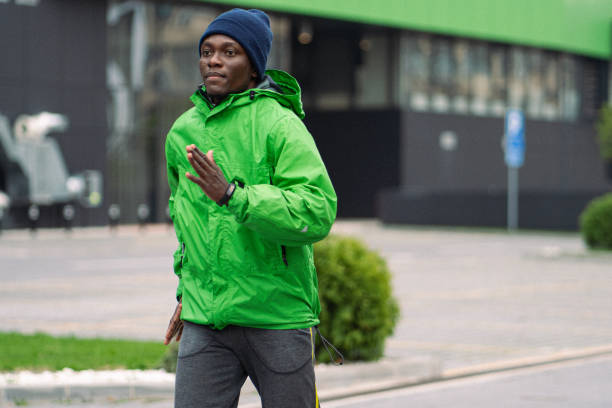 A young man is running early in the morning