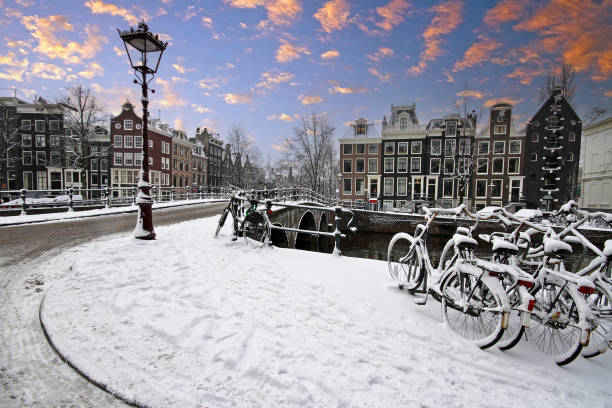 istock Snowy Amsterdam in the Netherlands at sunset 1919741636