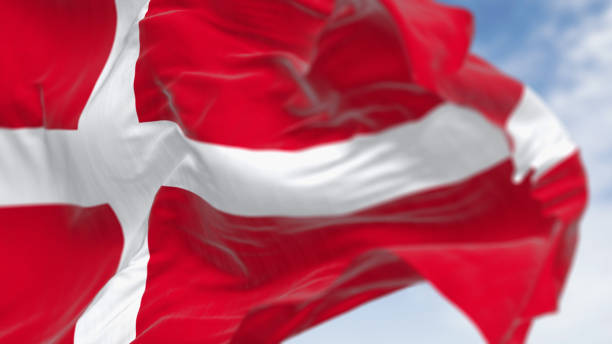 istock Denmark national flag waving on a clear day 1919750879